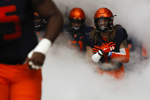 Syracuse players enter through the tunnel before Saturday's overtime win against Central Michigan.
