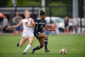 Sydney Brackett and a Notre Dame player fight for the ball during Sunday's 1-1 tie. The Orange last tied or beat a ranked opponent Sept. 22, 2013 when it tied No. 18 Duke, 2-2. 