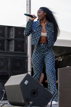 Flo Milli takes the stage as raindrops begin to fall and the dark clouds roll in overhead, but her music captured the audience and made them forget about the weather.