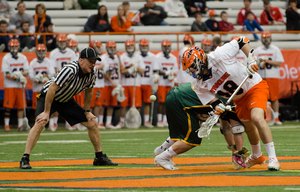 Mike Iacono wins a faceoff in Syracuse's 19-7 win over Siena on Monday night. The junior transfer is currently SU's second faceoffs option behind senior Chris Daddio. 