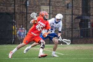 SU attack Randy Staats dodges toward the net i Syracuse's 21-7 loss to Duke on Sunday. Saats netted two highlight-reel goals in a poor all-around performance by the Orange. 