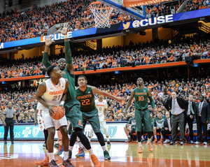 Tyler Roberson looks to go up in the post against a Miami defender. The SU sophomore recorded his fourth double-double, logging 10 points and 14 rebounds in the loss.