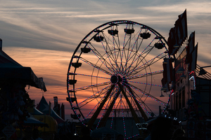 The lights begin to turn on at The New York State Fair's ferris wheel.