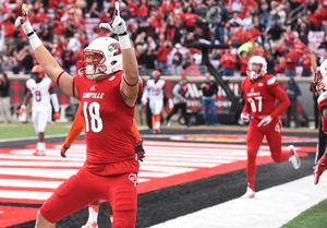 Louisville tight end Cole Hikutini celebrates one of his two touchdowns during SU's loss to the Cardinals. 