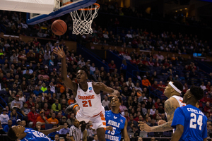 Tyler Roberson throws a right-handed shot toward the basket against Middle Tennessee State on Sunday. 