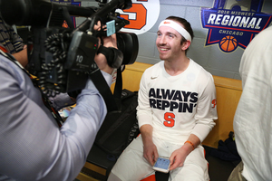 Syracuse walk-on Christian White was knocked over by Michael Gbinije during a celebration yesterday and it went viral. 