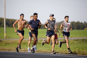 Dominic Hockenbury (far left) finished 21st in the 10000 meter on Saturday. 