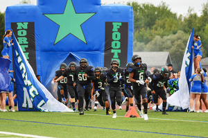 Cicero-North Syracuse emerges from the tunnel prior to kickoff.