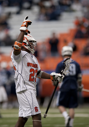 Jovan Miller celebrates during Syracuses 20-6 victory over Villanova Monday afternoon. Miller scored two goals as part of the high-powered Orange offensive attack.