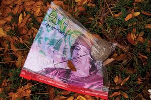 A bag containing a rock, a picture of Gadhafi with his face crossed out and the words, 'Evil has been vanquished' was found by the Wall of Remembrance outside the Hall of Languages on Friday. Gadhafi was killed Thursday after being seized in a sewage tunnel by LIbyan rebel fighters in his hometown of Surt.