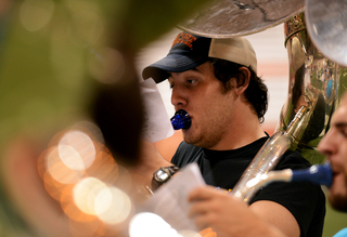 Shaun Kinney, a Syracuse University freshman, practices sousaphone during practice.