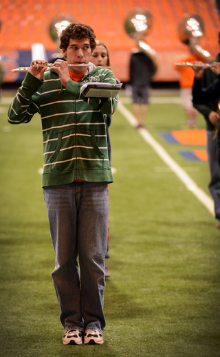 Brandon Lane, an SU senior and marching band piccolo player, watches the drum major.