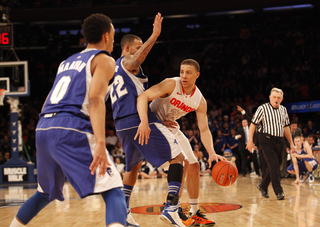 Brandon Triche works his way around Seton Hall's Brian Oliver. Triche broke out of a month-long slump with 17 points.