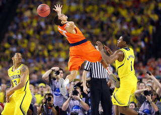 Michael Carter-Williams reaches back for a loose ball.