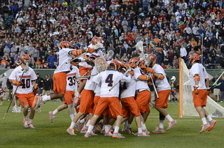 Syracuse celebrates its come-from-behind victory over Denver in the final four Saturday night. Derek Maltz scored the game-winning goal with 19 seconds left.