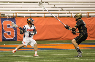 Kevin Rice surveys his options under defensive pressure. Rice scored three goals from 12 shots and had one assist Sunday night.