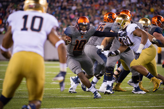 Hunt stiff arms defensive lineman Isaac Rochell before getting to the end zone for a touchdown in the fourth quarter.