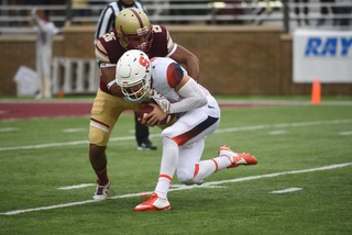 Syracuse quarterback Dungey gets taken down by Sharrieff Grice.