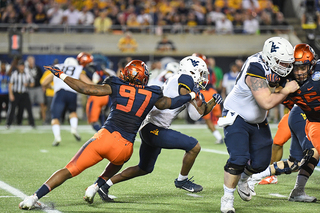 Redshirt junior Brandon Berry tries to tackle the ball carrier.