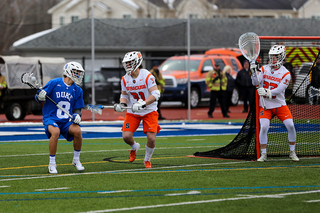 Jacob Buttermore (31) defends near the crease. 