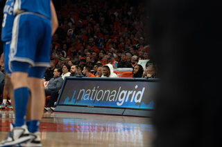 Buffalo Bills safety Damar Hamlin sits courtside at the Syracuse-Duke game. Hamlin attended the game with Adam Weitsman, entrepreneur, owner and CEO of Upstate Shredding — Weitsman Recycling. 